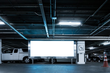 Parking lot underground interior with blank billboard,Blank area panel for advertise and decoration,Cool tone color effect.