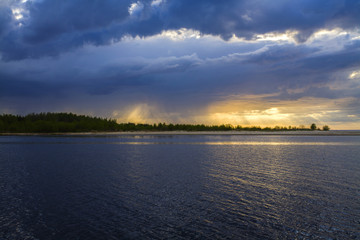 Latvia. Sunset on the river. Change in the weather. Elemental binge.