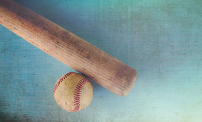 Dirty vintage baseball ball and bat show american sport through detail.  