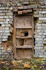 Old Broken door in the abandoned ruined building