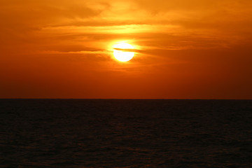 Cloudy sunset at sea in the quiet night