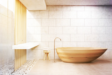 Fototapeta na wymiar Gray brick bathroom, wooden tub, front, toned