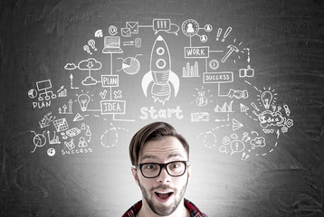 Excited man in glasses and a rocket