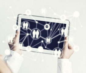 Close of female doctor hands working with tablet pc computer