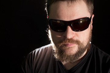 Obraz premium Handsome bearded man in sunglasses