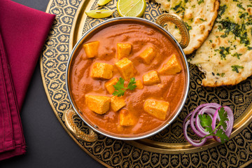 paneer butter masala or cheese cottage curry, popular indian lunch/dinner menu in weddings or parties, selective focus