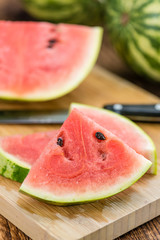 Portion of Fresh Watermelon on wooden background (selective focus).
