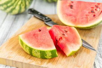 Portion of Fresh Watermelon on wooden background (selective focus).