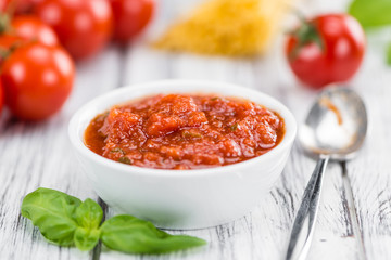 Tomato Sauce (selective focus) on vintage wooden background
