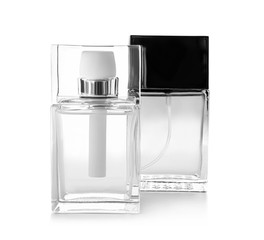 Bottles of modern male perfume on white background