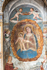 The Madonna with the child by Bonino da Campione in the church of The Eremitani (Chiesa degli Eremitani) on the tomb of Umberto da Carrara. Padua. Italy