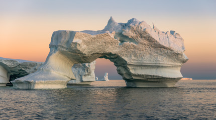 Iceberg in the Disco Bay, Greenland. Their source is by the Jakobshavn glacier. This is a consequence of the phenomenon of global warming and catastrophic thawing of ice - 144480335