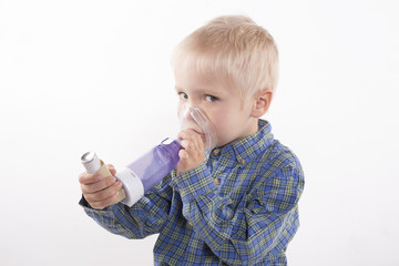 boy with asthma inhaler