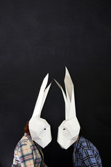Happy Easters rabbits couple in masks