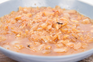 Onion soup on a wooden background