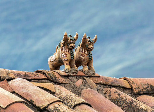 Ritual figurines of bulls on the roof in the village Raqchi. Temple of Viracocha at Chacha - Peru, South America
