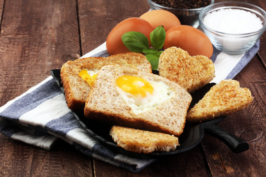fried eggs and toast with basil pepper and salt