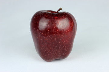 Red delishes apple on a white background