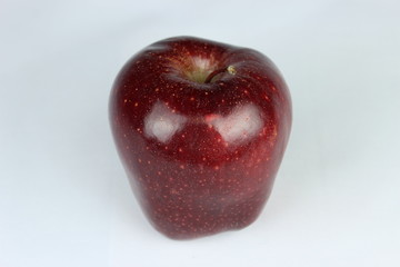 Red delishes apple on a white background
