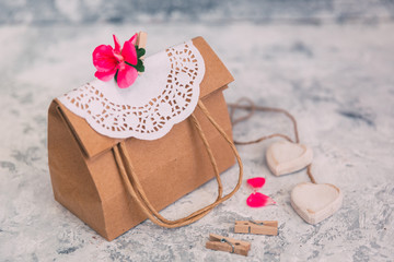 Paper bag with flowers. Present concept. Cute gift for mothers day