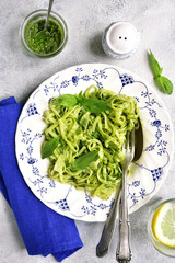 Pasta with green sauce pesto.Top view.
