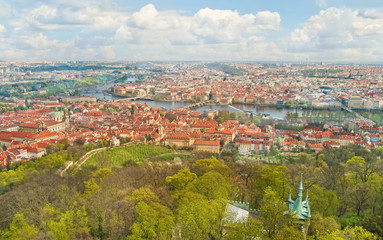 view of old european city in spring from hill top