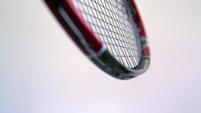 Slow motion badminton racket hitting shuttlecock