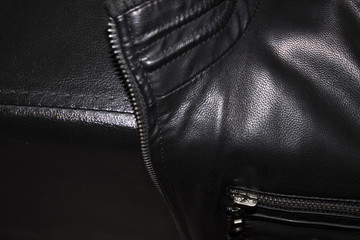 Black leather jacket on a leather armchair