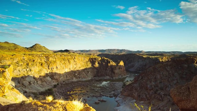 Motion controlled timelapse sunrise over the gorge at Ararat in Augrabies Falls National park looking down onto the Orange River, with clouds moving, linear from left to right available on request.