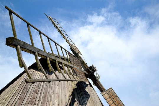 windmill wing mill grain against a blue sky