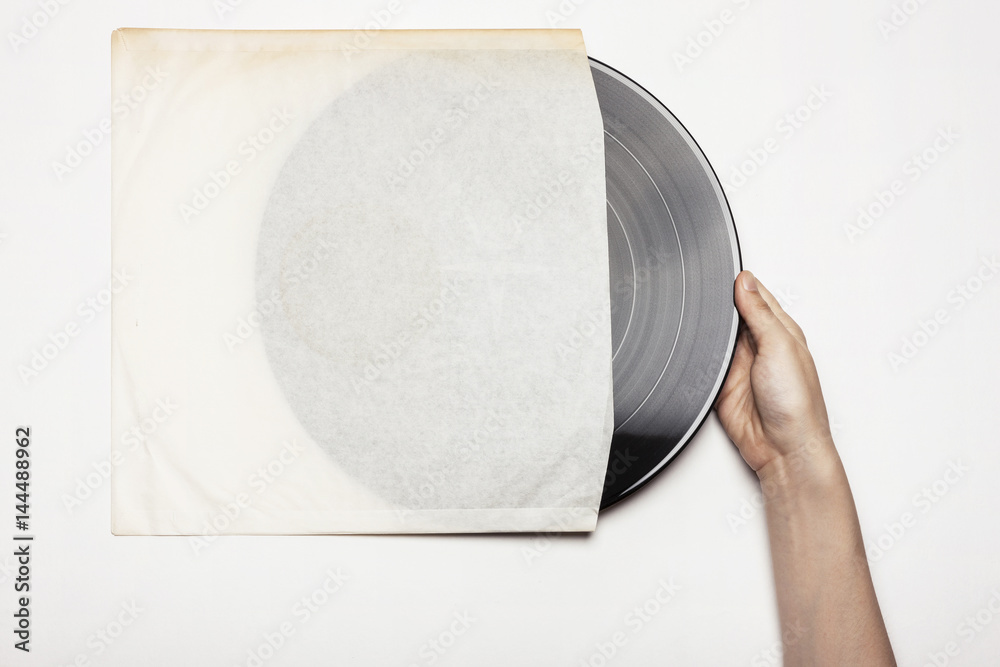 Wall mural woman(female) hand hold a record isolated white.