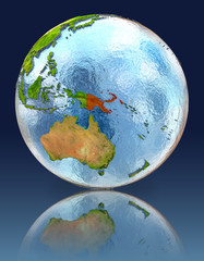 Papua New Guinea on globe with reflection