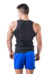 Attractive muscular young man's back , in t-shirt and short, isolated on white background
