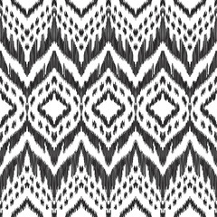 Vector Ikat seamless pattern. Navajo, aztec ornament. Creative hippies print. Black and white colored illustration. American ethnic backdrop.