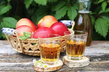 Apple juice and red apples
