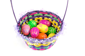 Fototapeta na wymiar colorful Easter eggs in basket isolated on white background