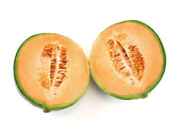 close up on fresh melon cut in half isolated on white background