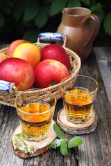 Apple juice and red apples