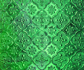 Green Pattern glass in Thai style of the house window.