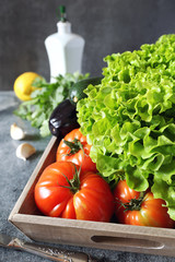 Fresh lettuce, tomatoes, aubergine and zucchini