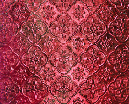 Red Pattern glass in Thai style of the house window.