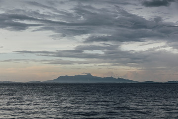 Seascape with Raining Cloud and Mountain at Dusk of George Town, Penang, Malaysia. 