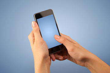 Female hand holding smartphone