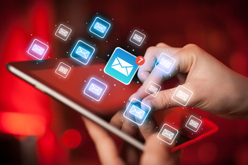Fingers touching tablet with mail