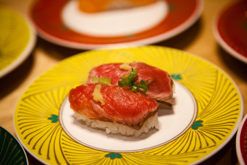 Obraz na płótnie Canvas Rare Japanese Gyuuniku Beef Tataki Nigiri Sushi Close Up