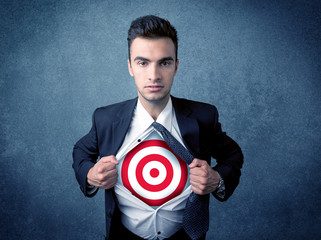 Businessman tearing shirt with target sign on his chest