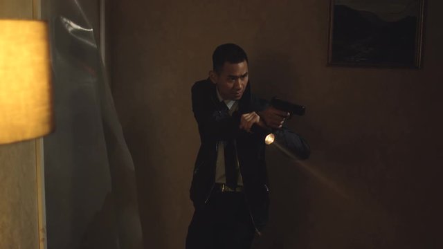  Special police officers with handguns & flashlights raiding dark apartment.