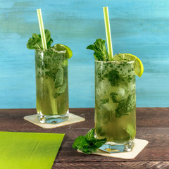Mojito cocktail with mint leaves and lime