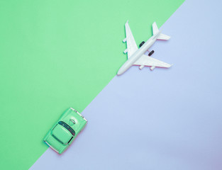 Travel around the world for your colorful life .Enjoy the funny trip journey .Top view for copy space some idea your create destination .object  cute  car and plane  vintage on color background.