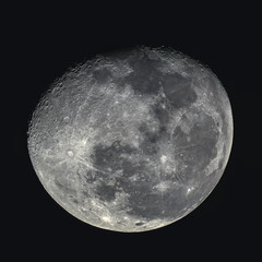 Waning gibbous moon at 89% illumination captured with an astronomical telescope (photo taken with...